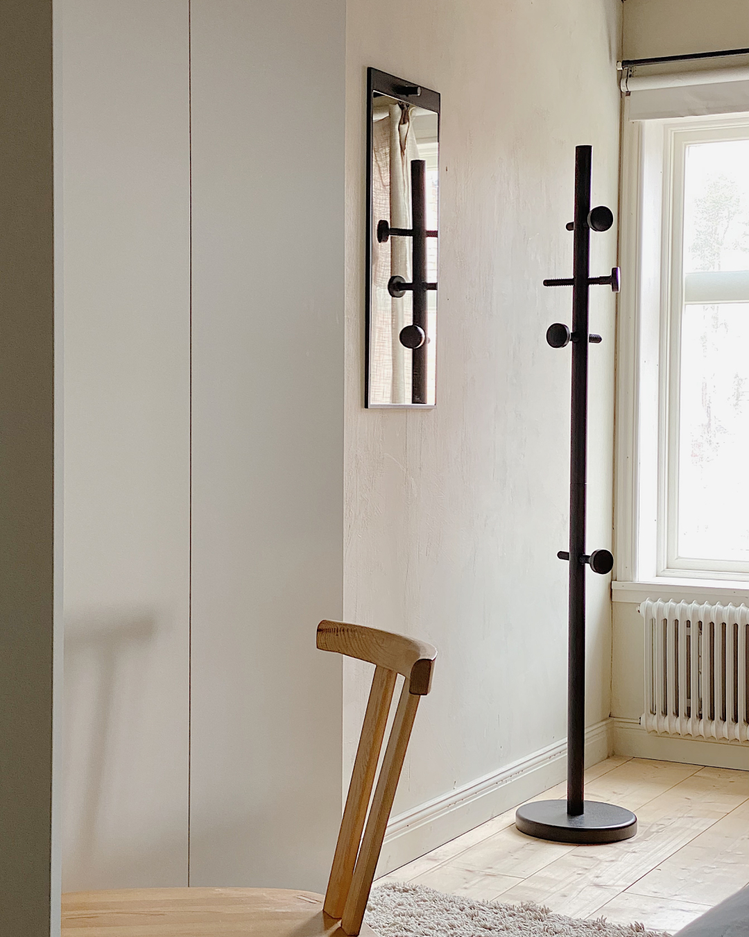 The Tillbakablick mirror and Skruvad coat stand works good together in an old apartment