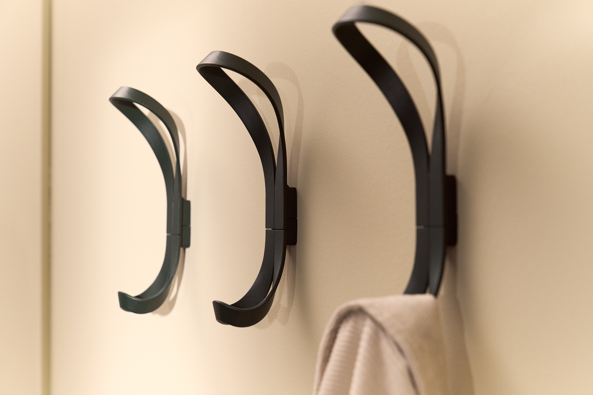 Three fir green Endless hook in a row gives a sculptural interiror